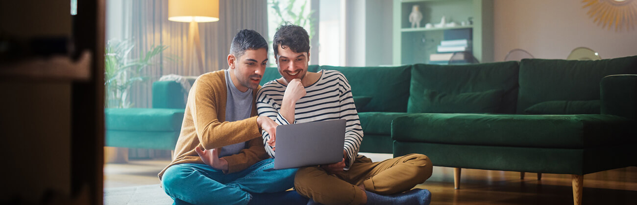 Two guys appreciate the benefits of Mesh WiFi in their home