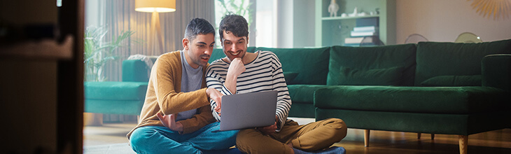 Two guys appreciate the benefits of Mesh WiFi in their home