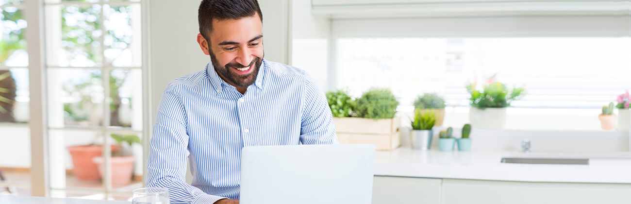 Man on laptop at home